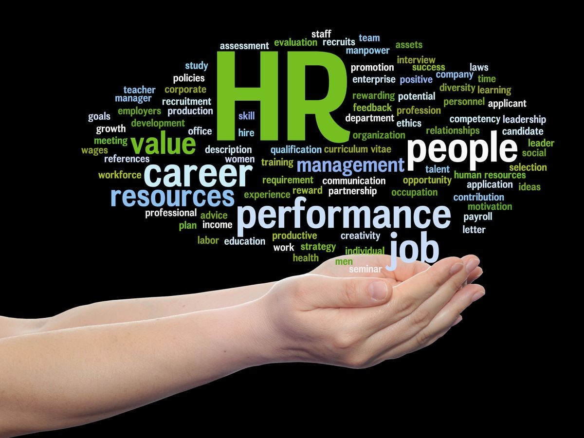 Concept conceptual hr or human resources management abstract word cloud in hand isolated on background, metaphor to workplace, development, career, success, hiring, competence, goal, corporate or job